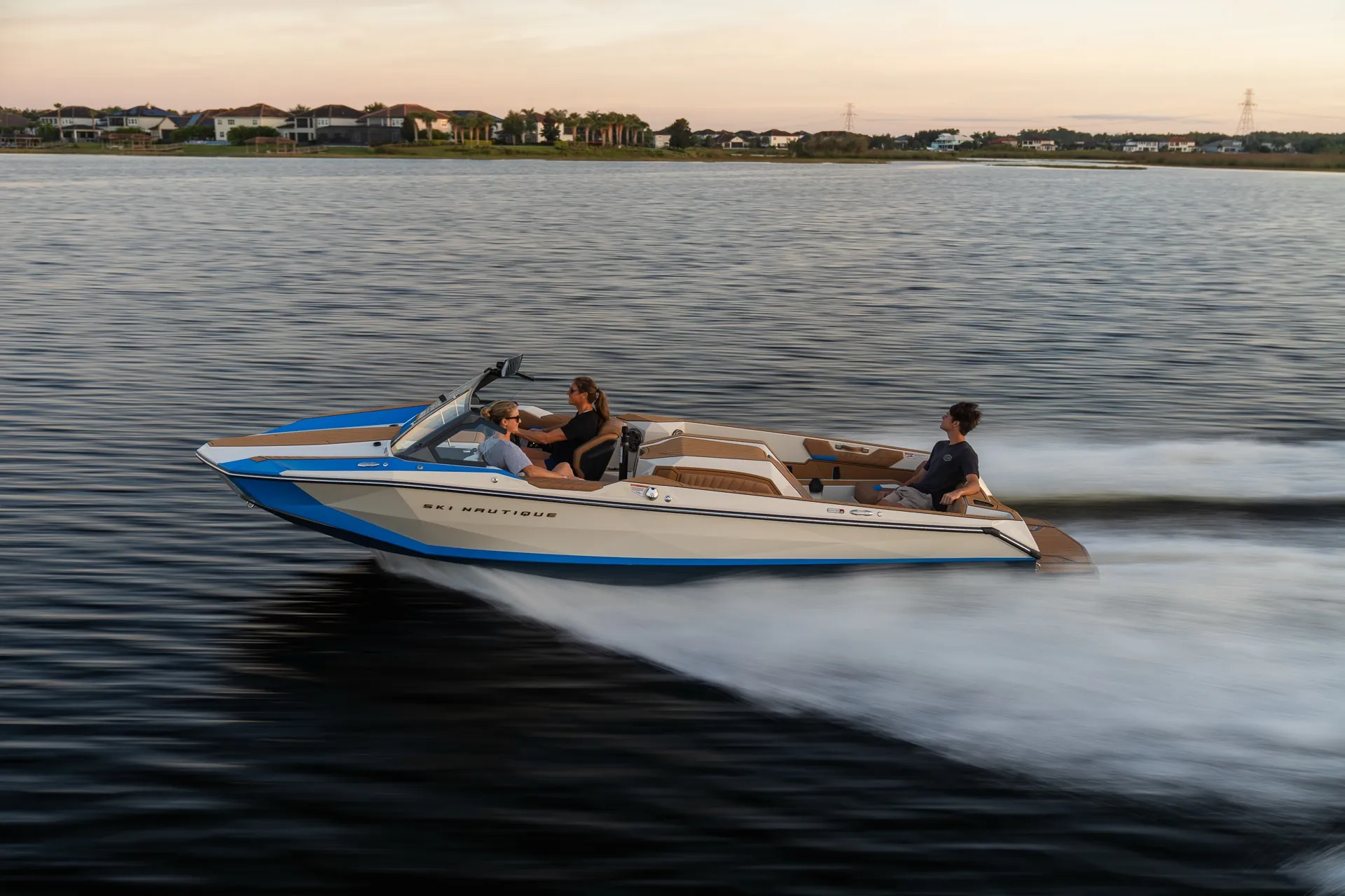 A Ski Nautique towing a slalom skier